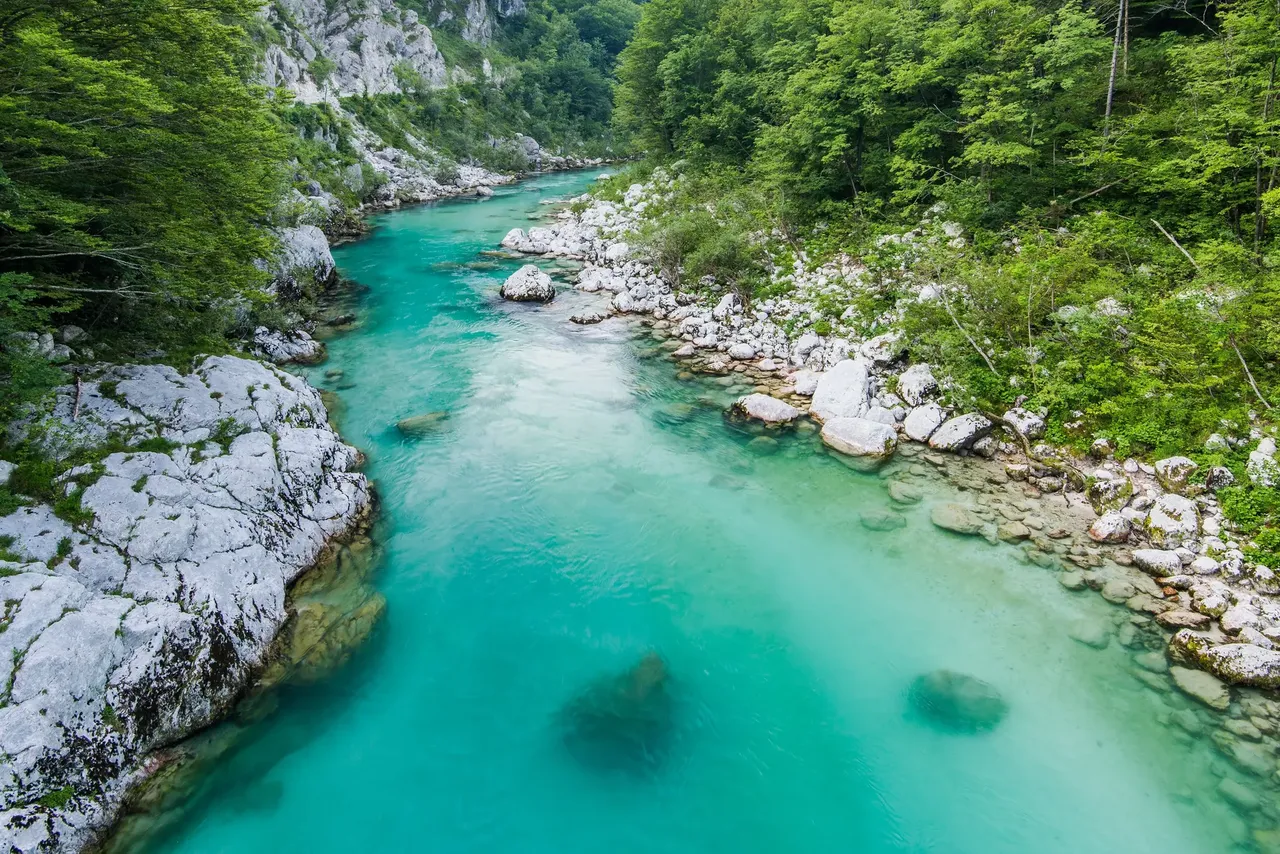 The crystal clear waters of Soča river are a great opportunity for rafting or swimming - Shutterstock september