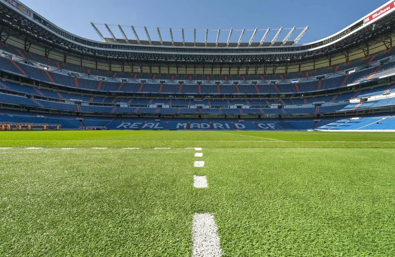 Turf and stand on sunny day at Santiago Bernabéu Stadium — Shutterstock