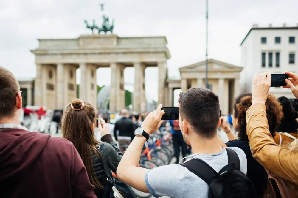 Tourists take photos of Brandenburg Gate — Getty Images