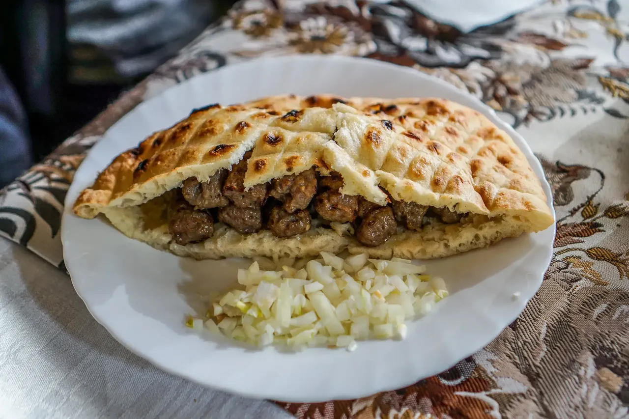 Accompanied with bread and onions, cevapi is takes a huge part in the great local cuisine — Shutterstock