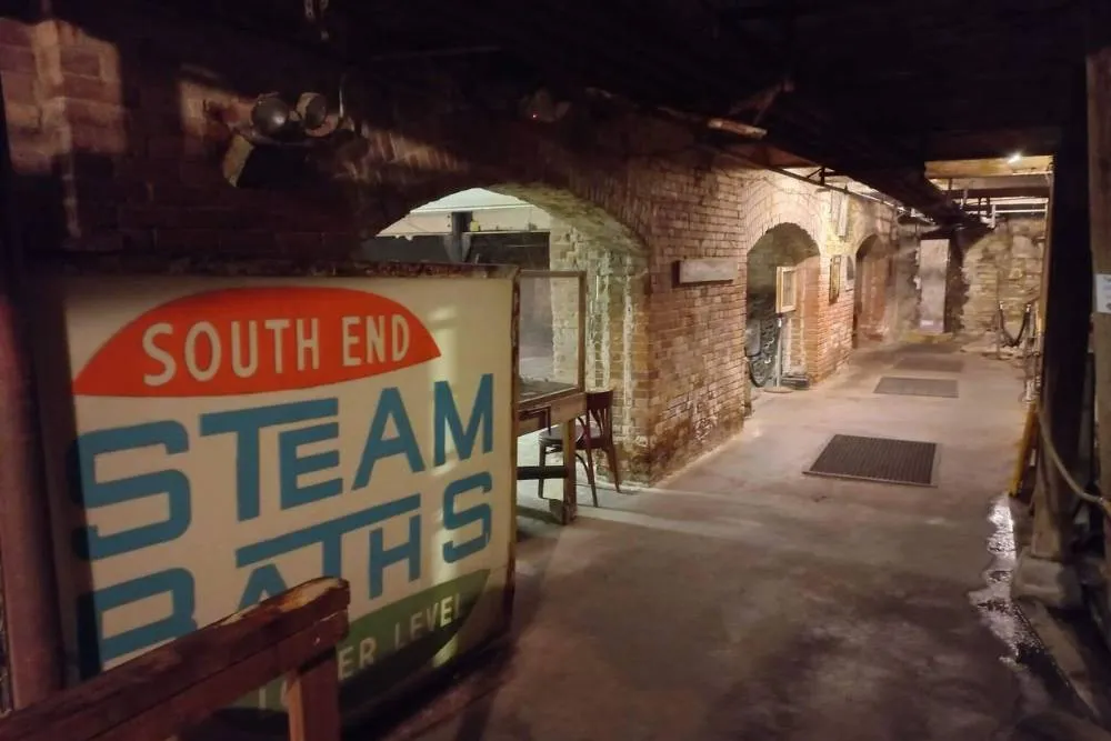 Old shop sign in the catacombs of Seattle — David Szmidt