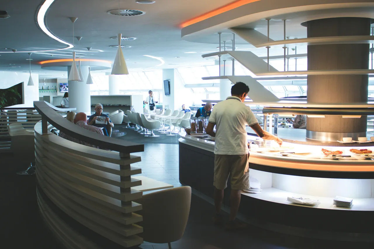 man in a business lounge at the airport