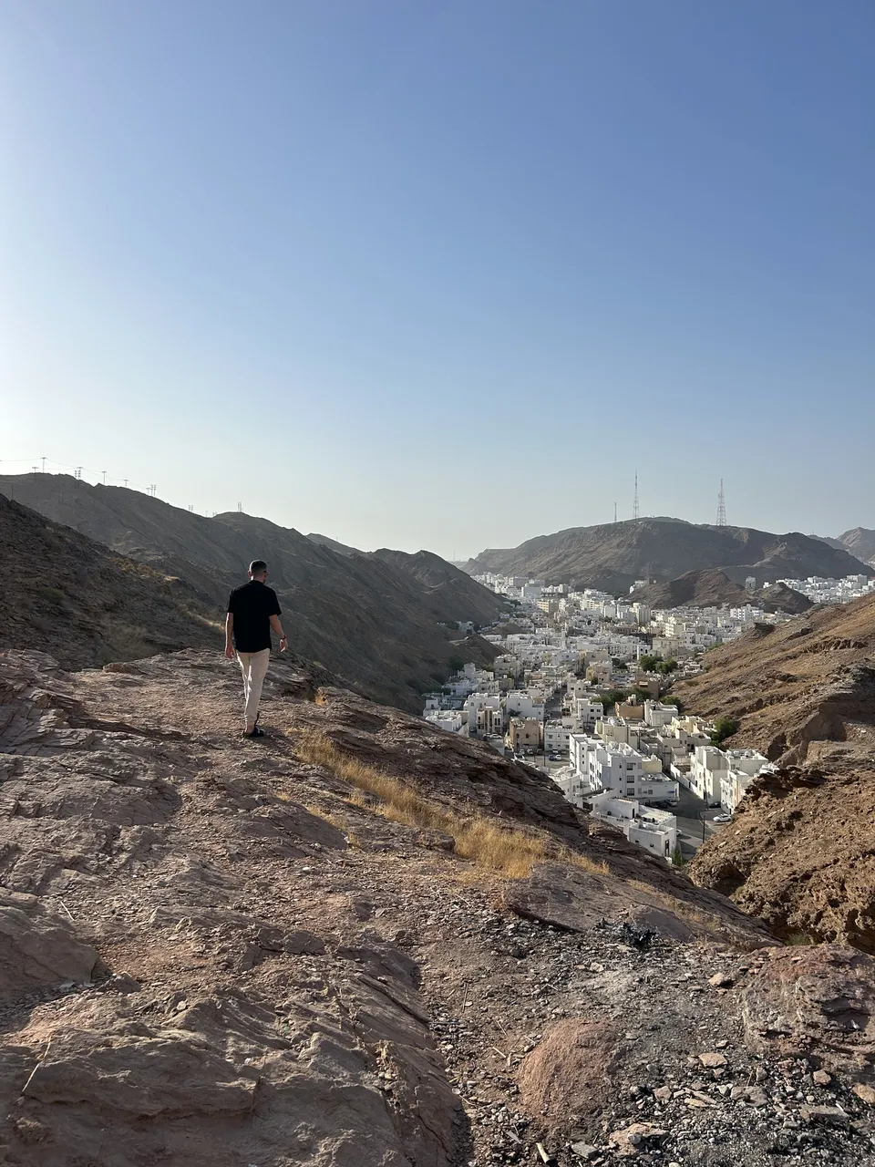 Panoramic view of Muscat’s coastline and cityscape from a hilltop