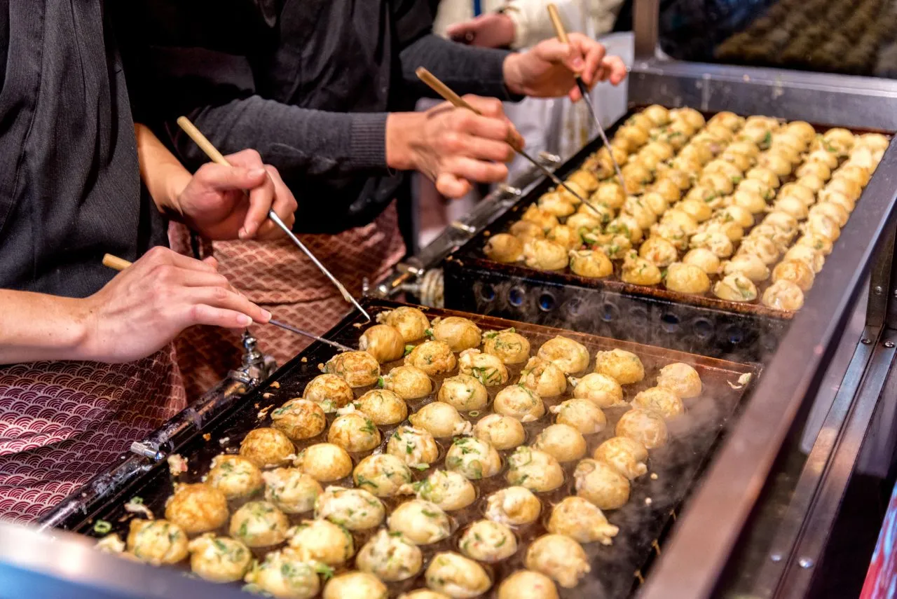 Process to Cooking Takoyaki on hot pan Famous food Osaka Japan street food