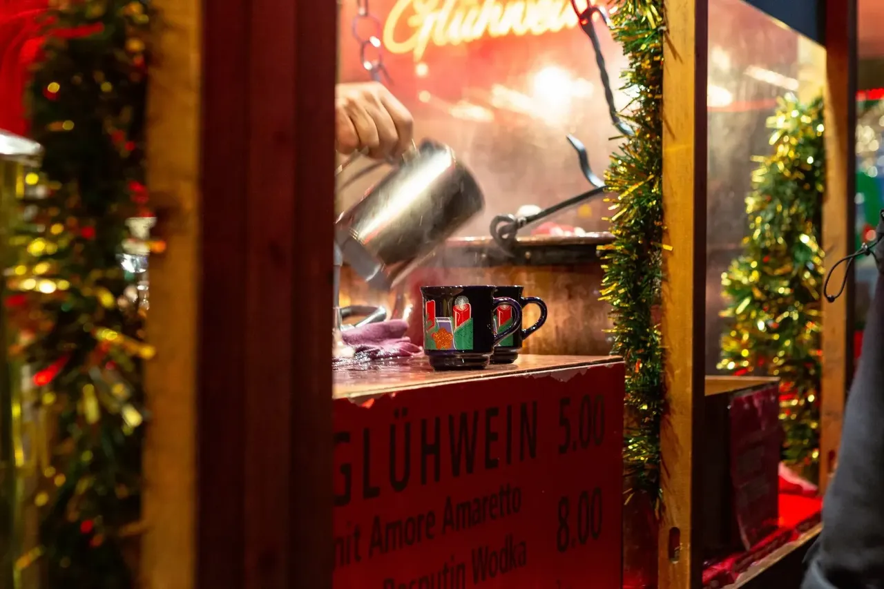 A steaming cup of glühwein at the Basel Christmas Market, perfect for warming up on a chilly evening.