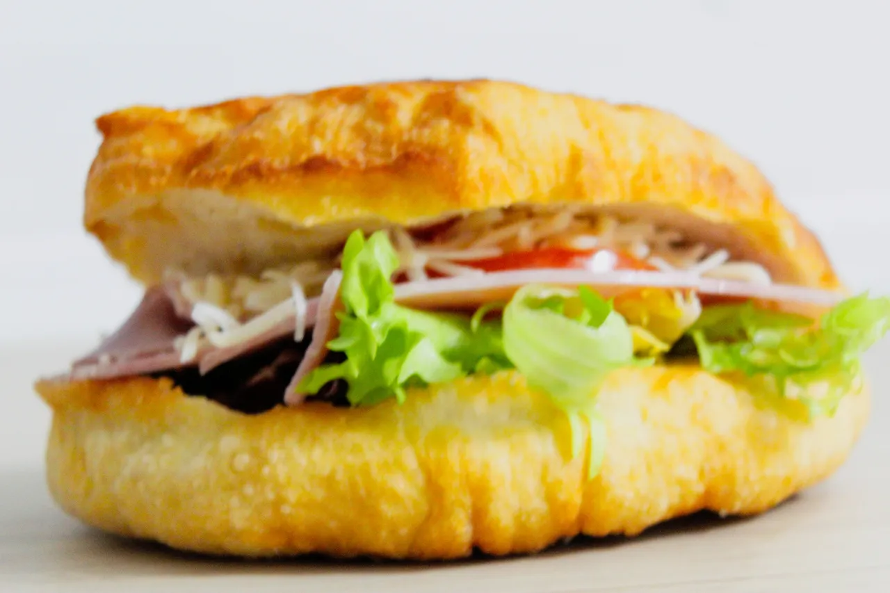 a Caribbean specialty garnished with ham, cheese, salad and tomato
