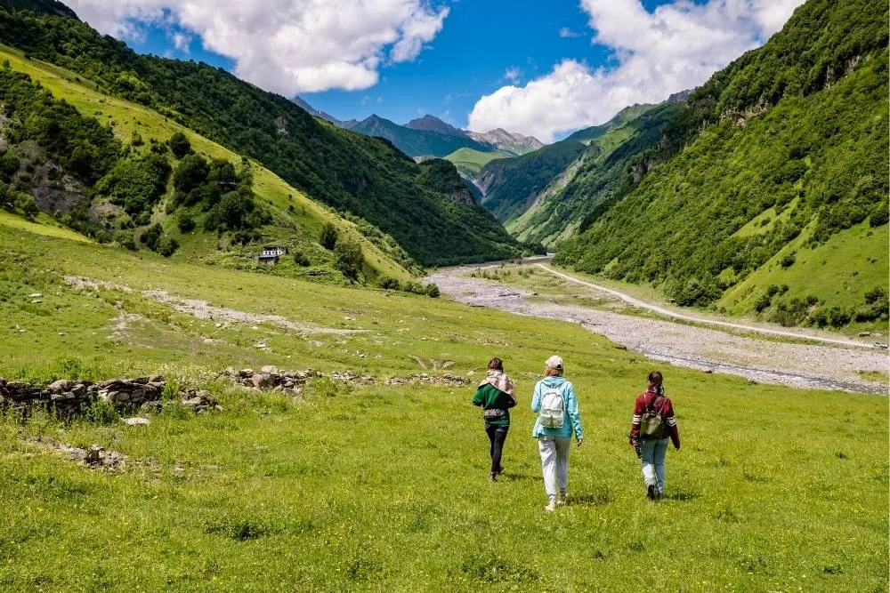 Three walkers in the countryside — Shutterstock