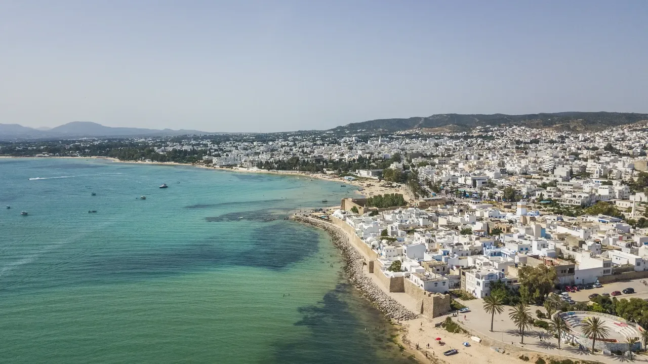 Overhead view of Hammamet, Tunisia, highlighting its sandy beaches, turquoise waters, and charming coastal architecture.