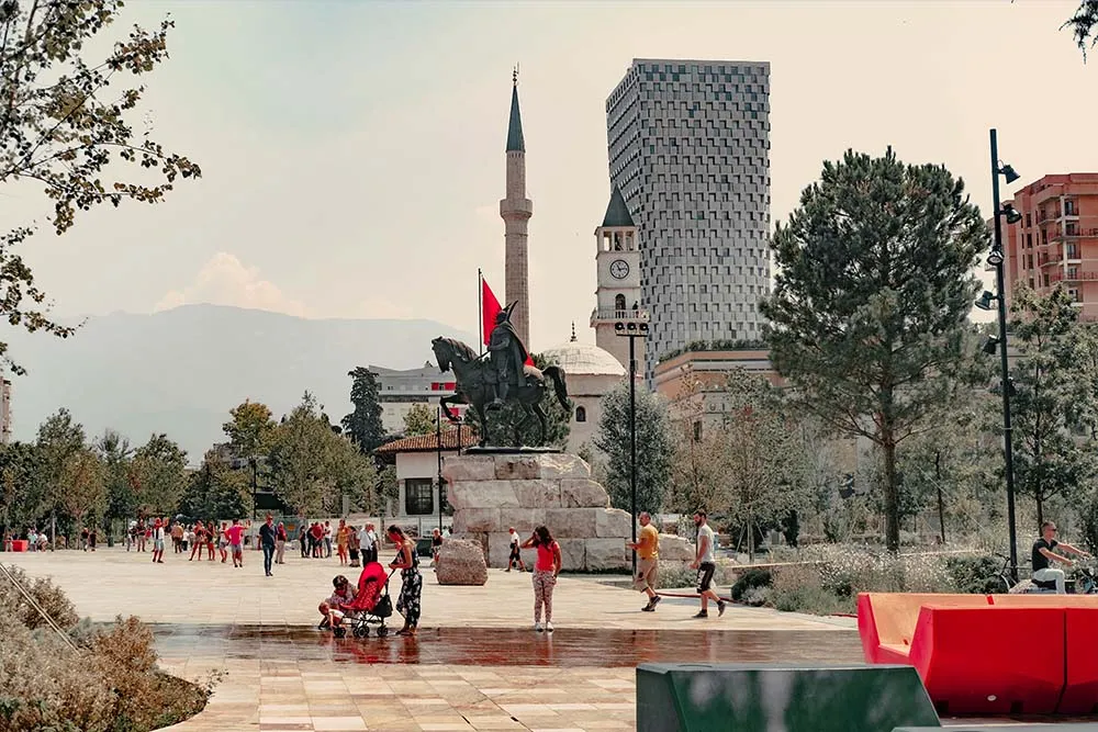 people sitting in a square Tirana