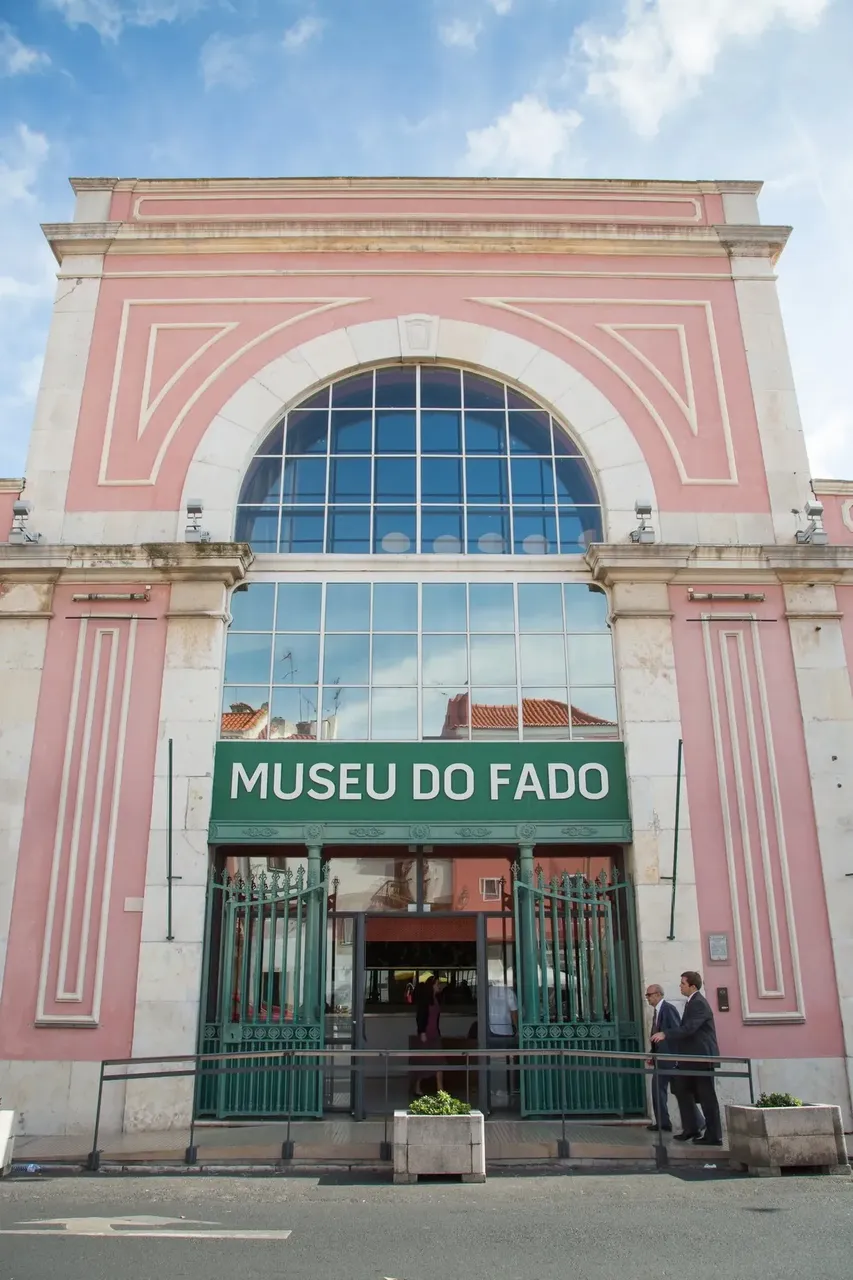 The exterior of the Museu do Fado in Lisbon, a cultural landmark dedicated to traditional Fado music, with a modern facade and signage.