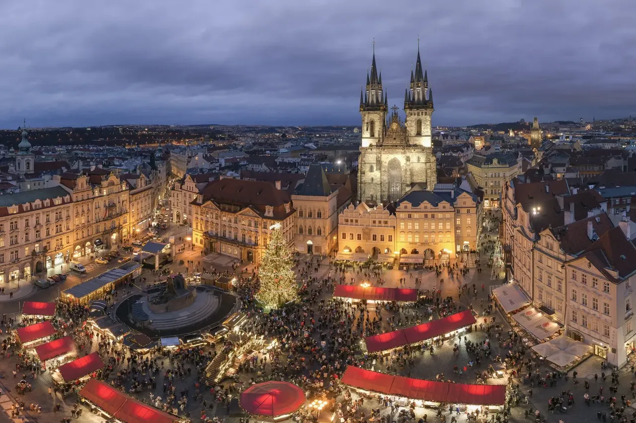 An aerial view of Prague’s magical Christmas market with Old Town Square as the backdrop.