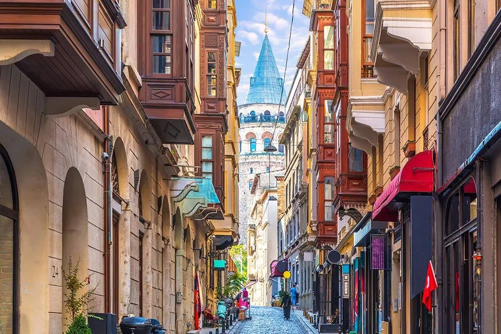 The view of the Galata tower in Istanbul, Turkey from a narrow street