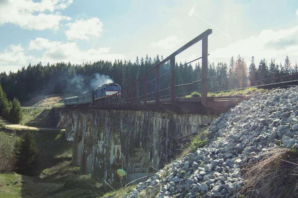 Train runs along old mountain bridge — Getty Images
