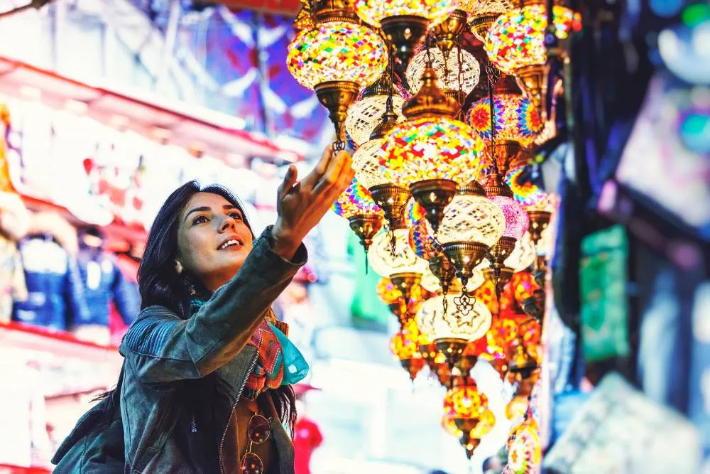 Woman admiring Turkish lantern lamps — Getty Images
