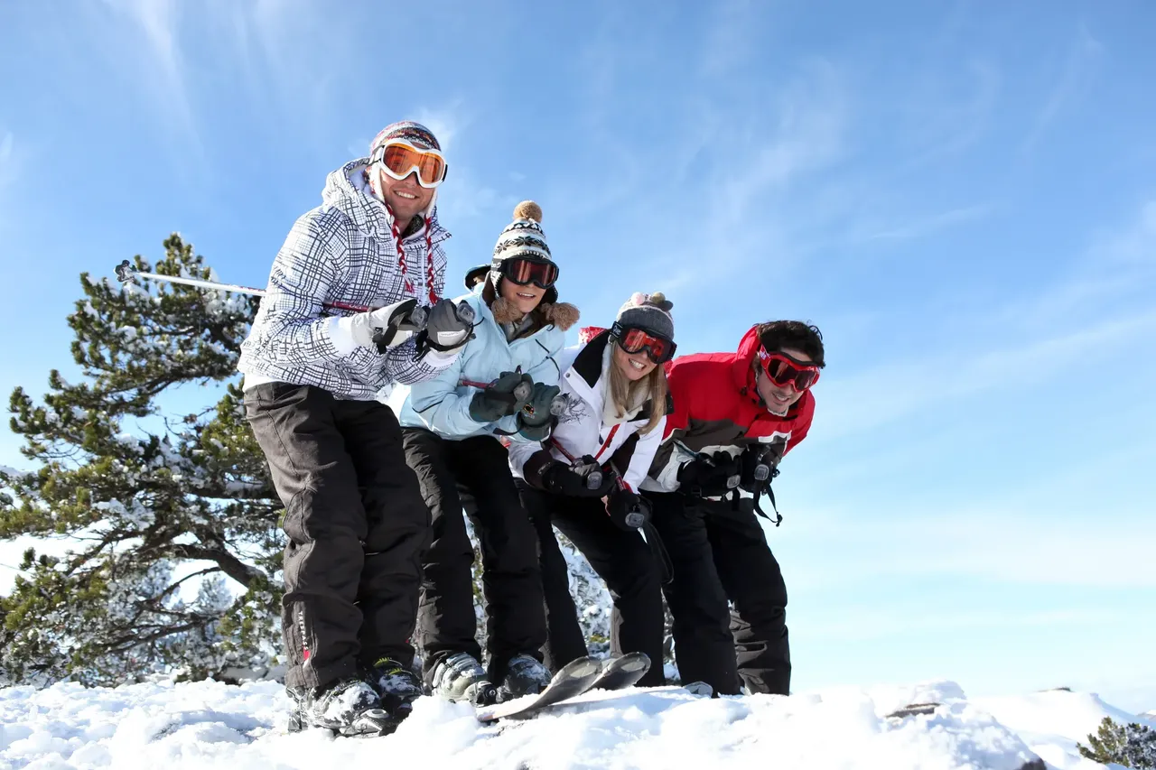Group of friends skiing — Shutterstock