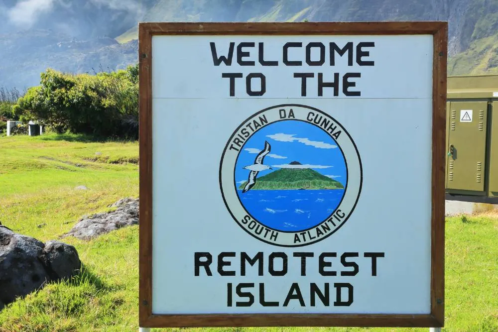 Large signpost reading ‘Welcome to the remotest Island, Tristan da Cunha, South Atlantic" — Getty Images