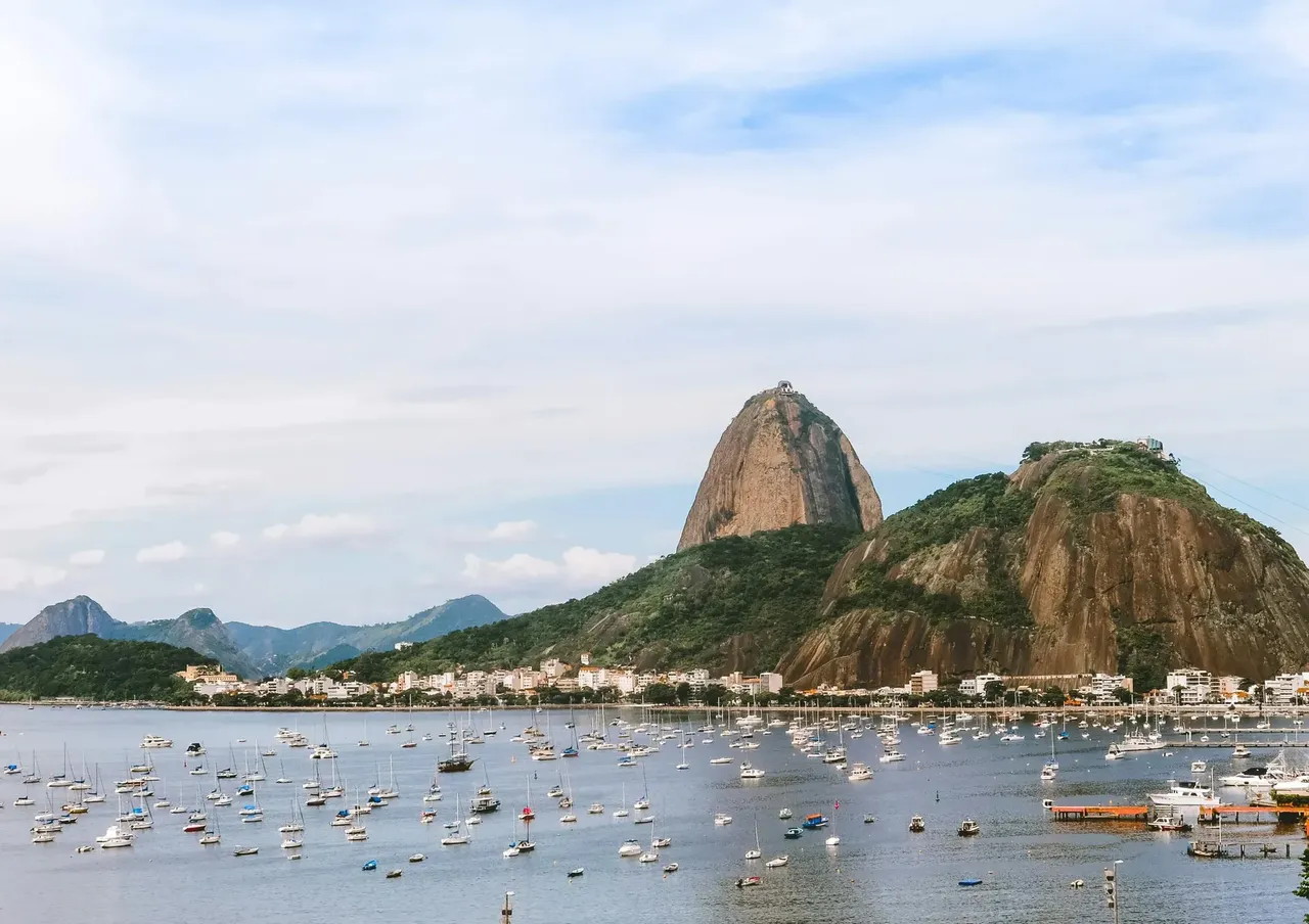 A scenic view of Sugarloaf Mountain and boats in Guanabara Bay, Rio de Janeiro, Brazil