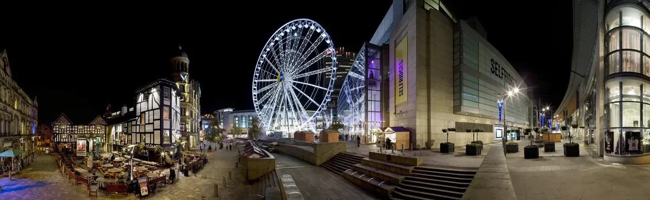 The Manchester Christmas Market, featuring festive stalls and a glowing Ferris wheel.