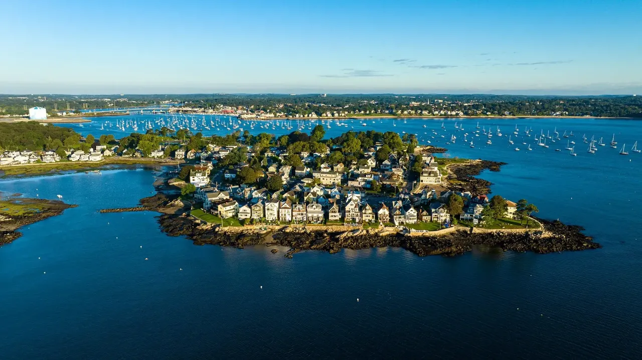 An aerial view of Salem, Massachusetts, showing the coastal landscape with an island and historic houses