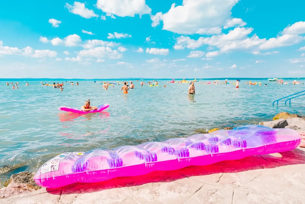 Swimming is just one of the many pastime activities at the Hungarian lake — Vera Petrunina / Shutterstock 7 European lakeside holidays for 2019 lake beach