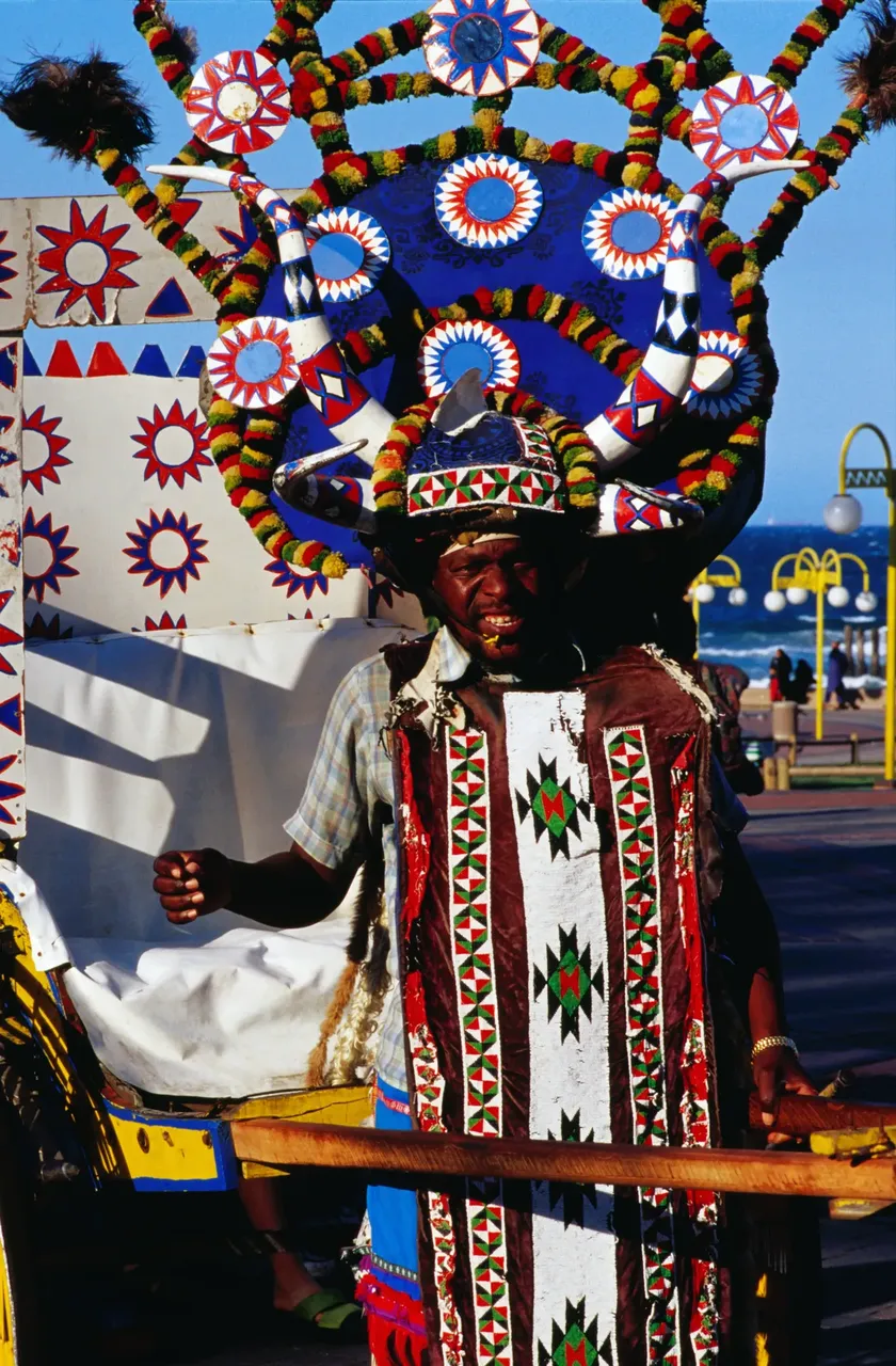 Durban Rickshaw puller in traditional dress — Getty Images