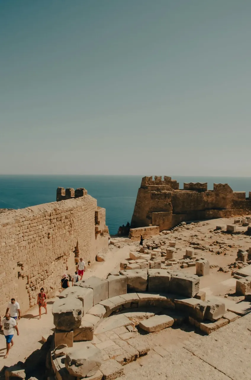 The imposing medieval castle of Rhodes, Greece, with its tall stone walls, towers, and fortifications, standing as a testament to the island’s rich history