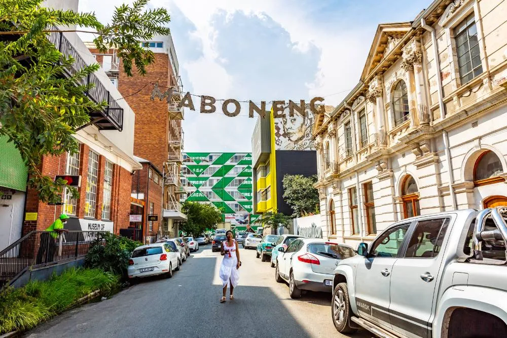 Woman stood in street in Maboneng — Getty Images