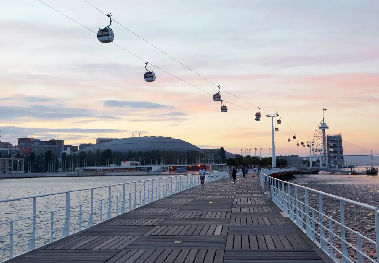 Promenade and cable cars at sunset, at the Park of the nations (Parque das Nacoes)
