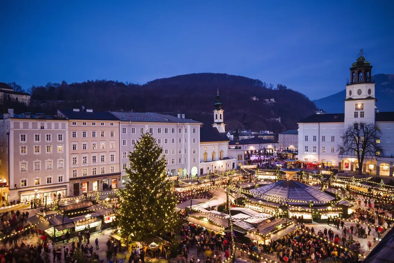 A bird’s-eye view of Salzburg’s enchanting Christmas market surrounded by historic architecture.