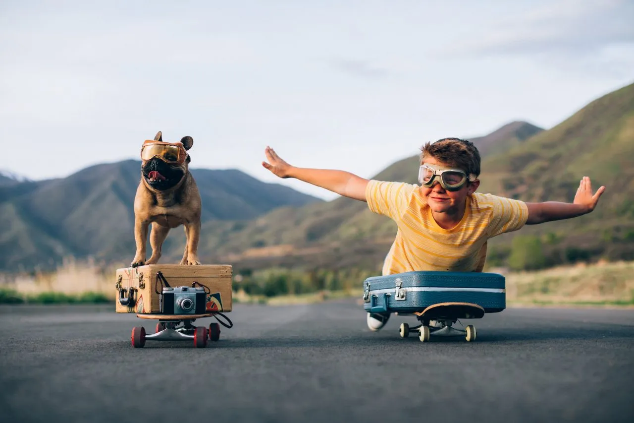 Traveling Boy and his Dog on skateboard