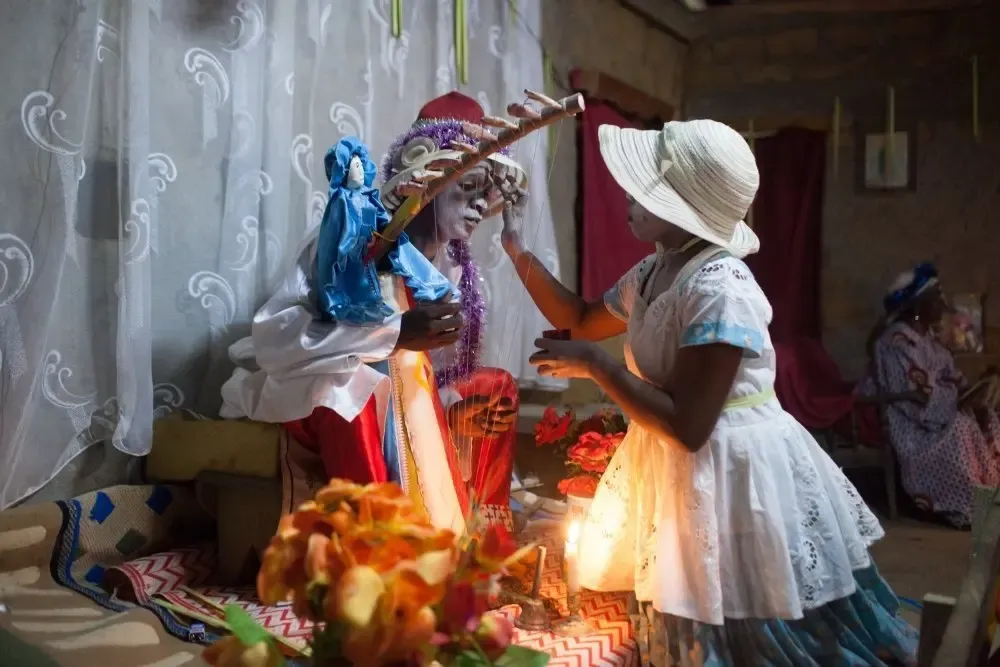 Paint is applied to the faces of those taking part in the iboga ceremony in Gabon – Swiatoslaw Wojtkowiak