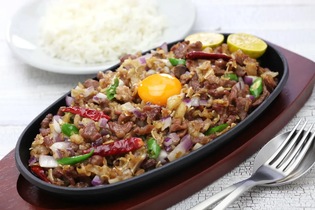 Sisig and is made of the face and head of the pig, as well as the liver — Shutterstock