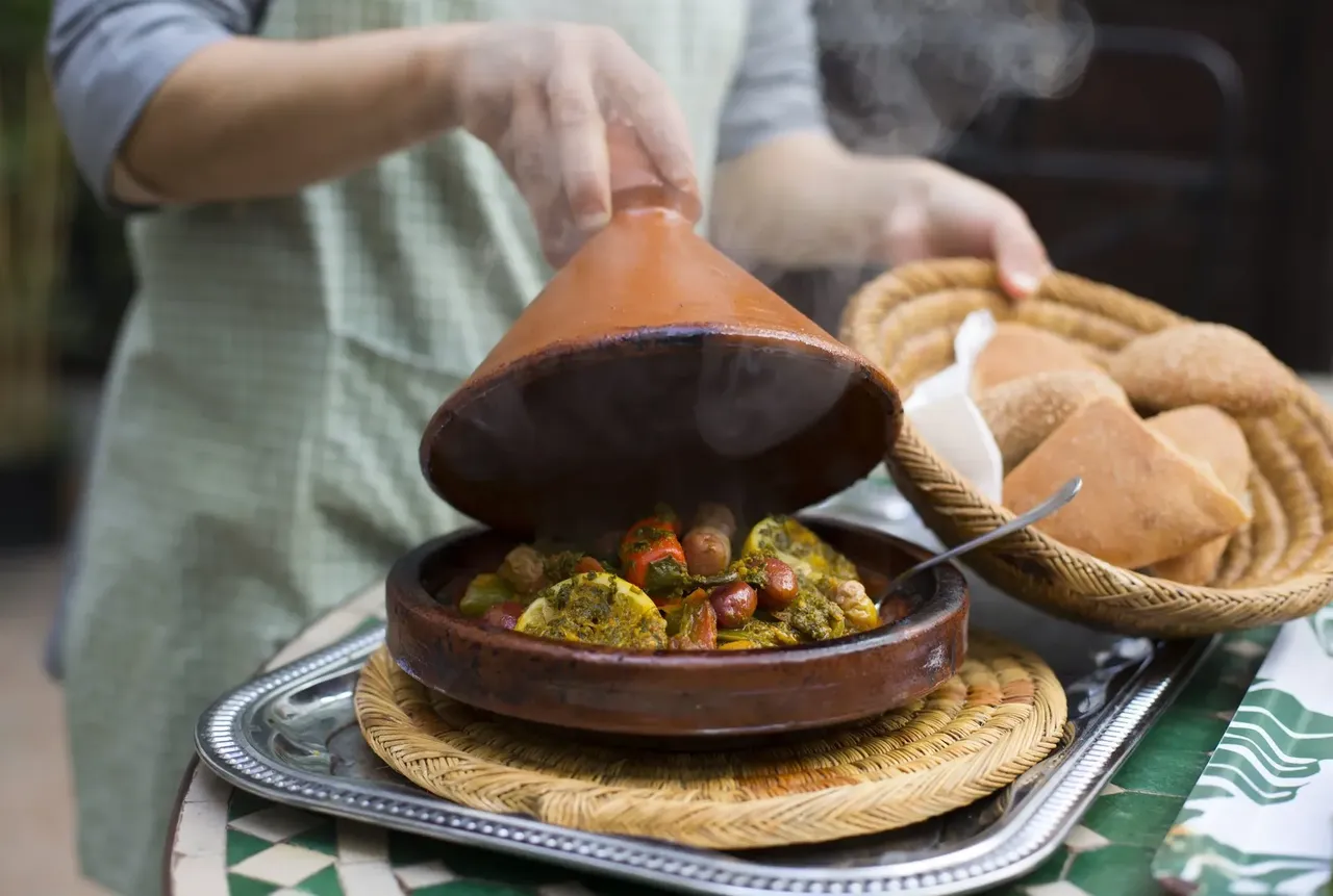 Tajine dish simmering with vibrant spices