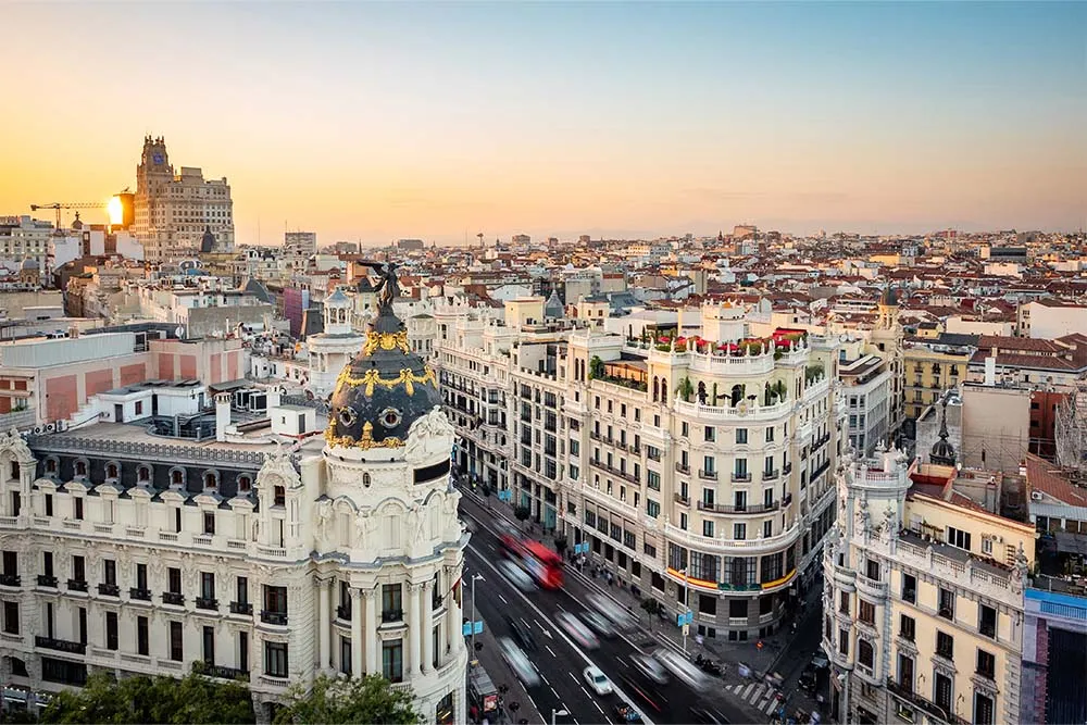 Sunset over Gran Vía street — Shutterstock