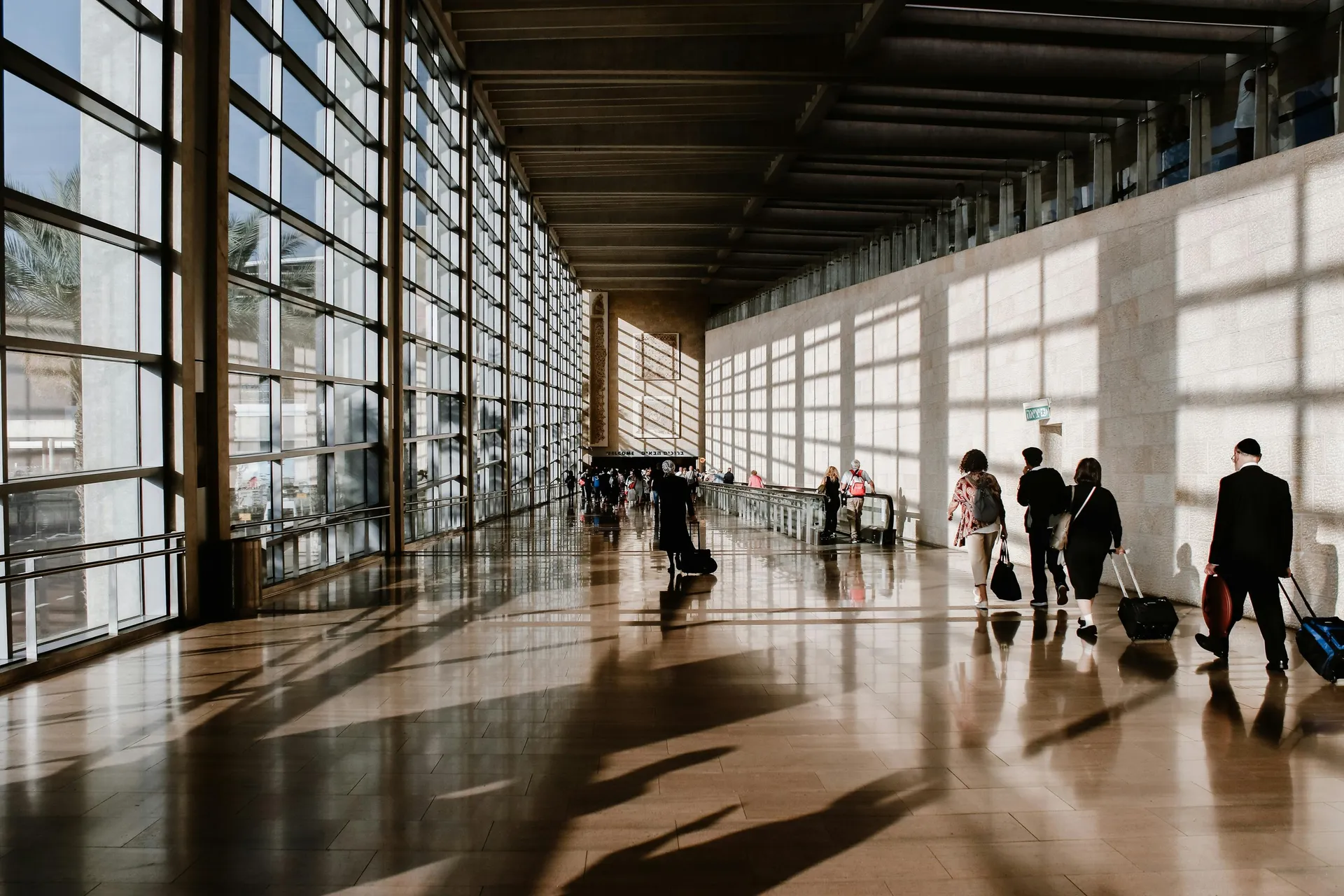 Traveler packing documents and a passport at home the night before a flight
