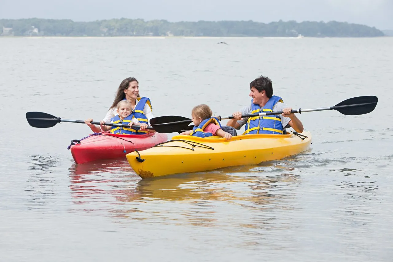 Couple and daughters kayaking in Hilton Head, U.S.A.