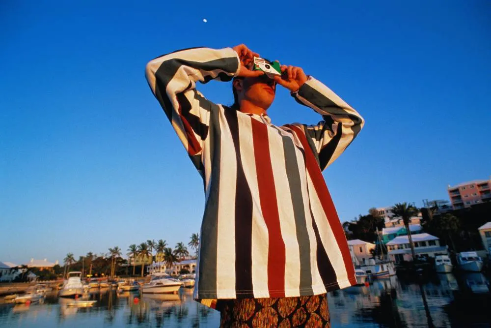 Tourist with disposable camera — Getty Images