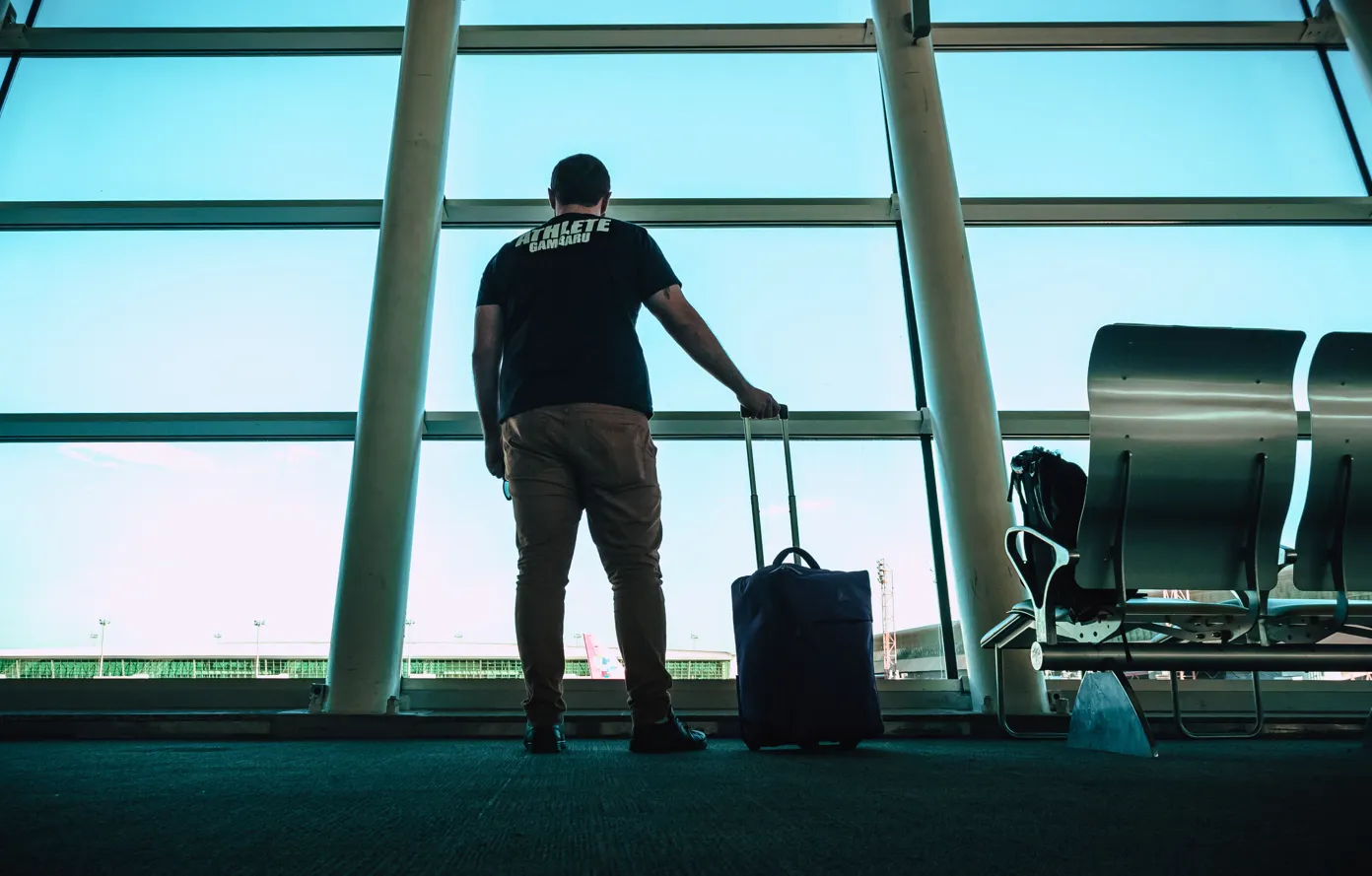 Person with a suitcase in an airport