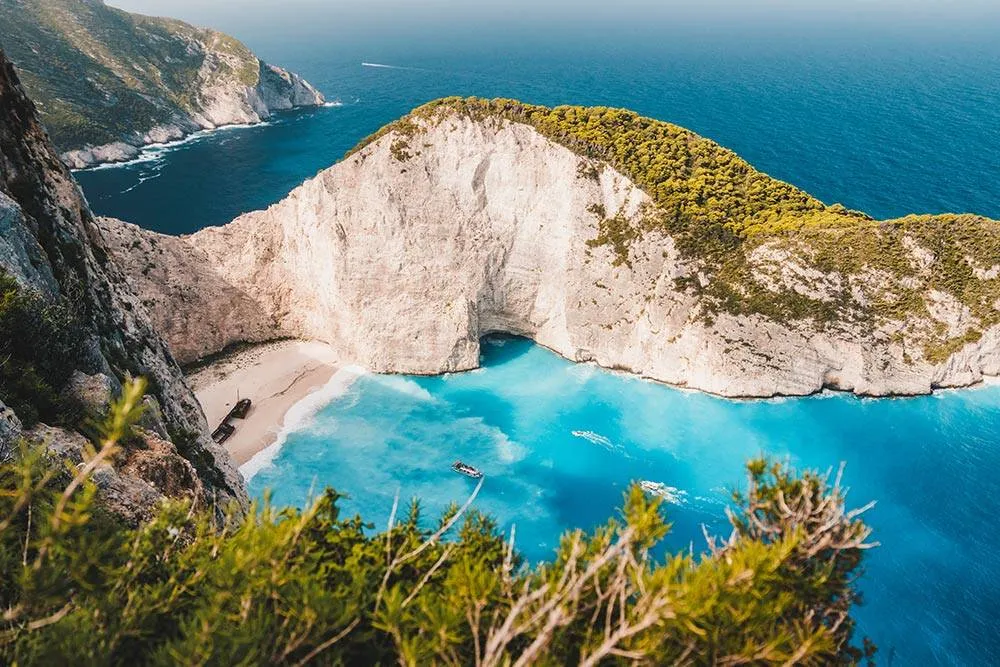 Navagio beach from above, the famous shipwreck just visible on the left