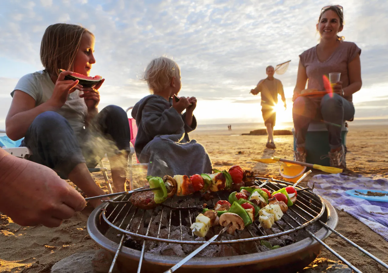 Family BBQ with a toddler son and five years old daughter on the coast, Amelia Island, U.S.A.