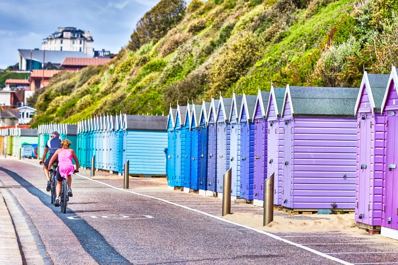 Beach huts at Bournemouth, Dorset, bikes, roads, beach town