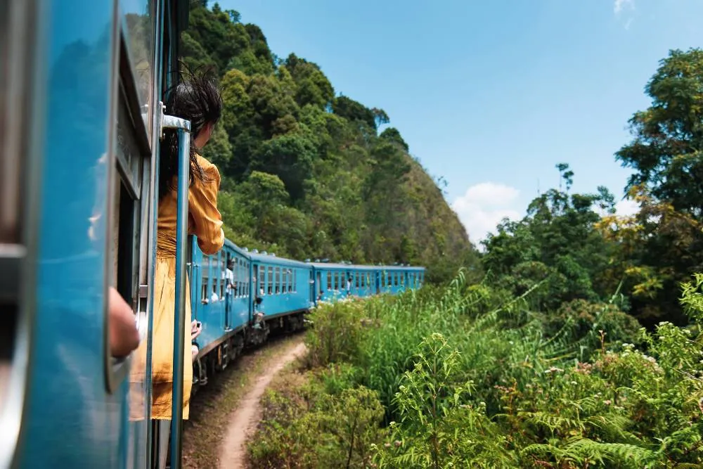 Long blue rural train in Sri Lanka — Getty Images