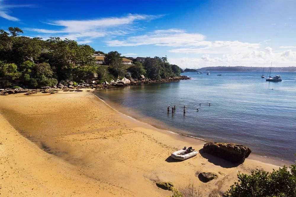 Collins Beach, sparse with people on a sunny day — iStock