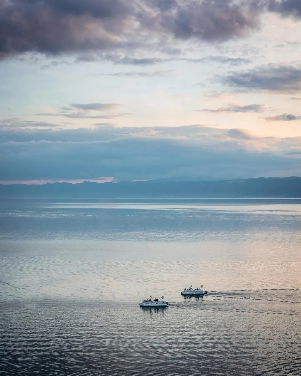 Lake Ohrid with two boats at sunset