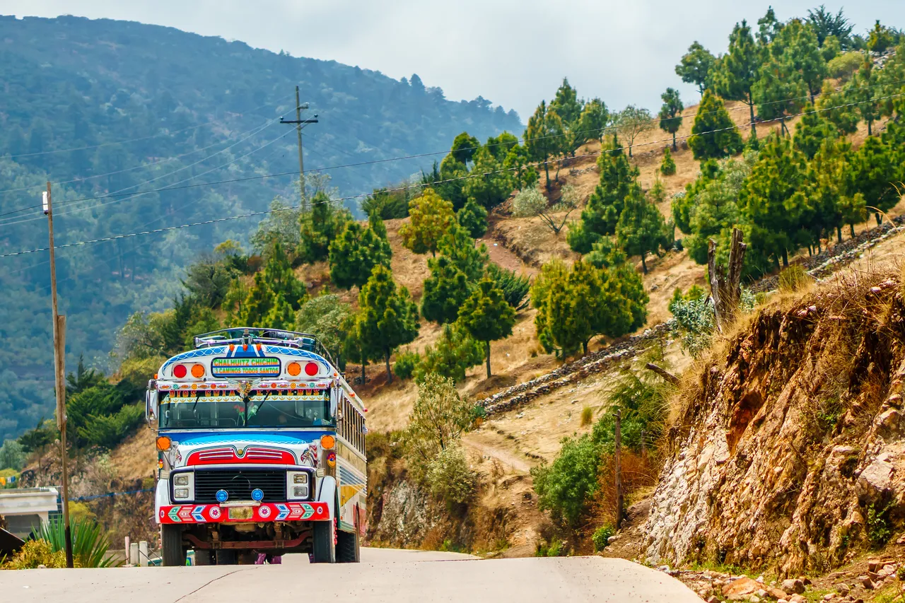 View on old school bus used as public transport by Todos Santos Cuchumatan in Guatemala
