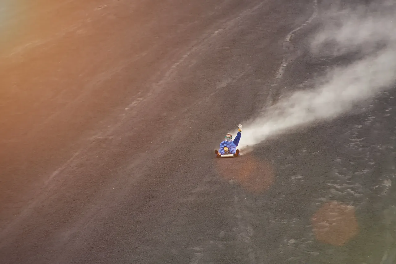 Person from a distance, partaking in volcano boarding — Shutterstock