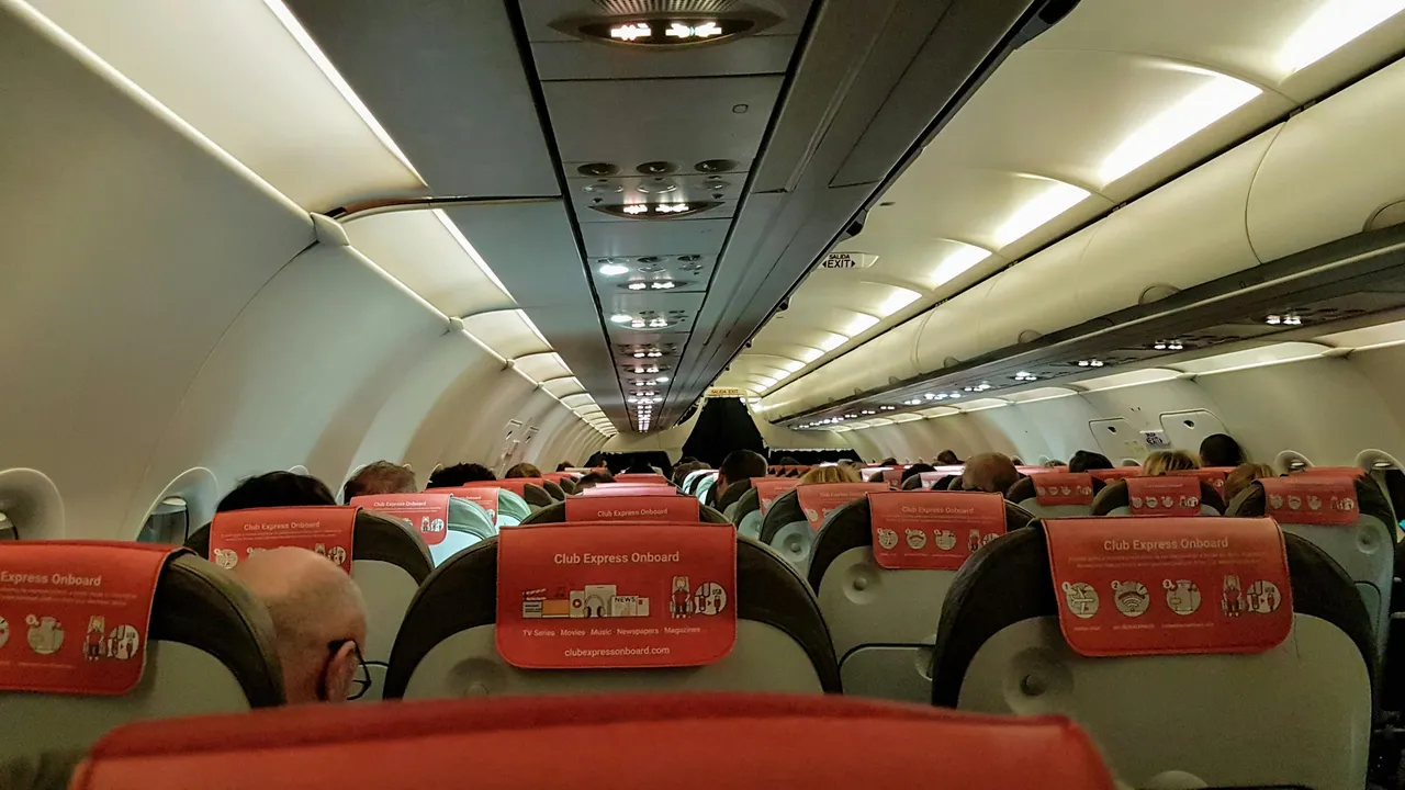 the inside of an airplane with several seats