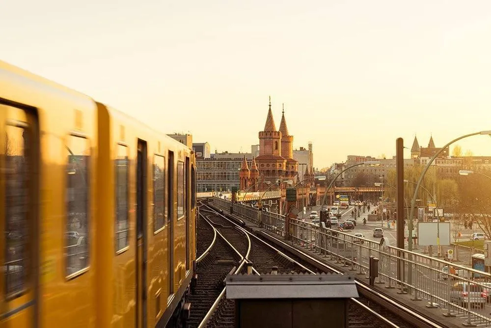 Yellow tram passing over Oberbaum Bridge in Berlin, Germany