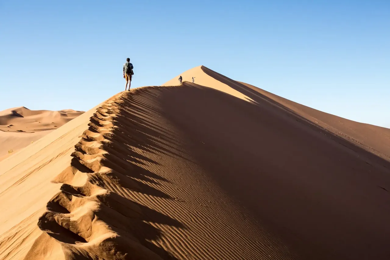 The mighty Sossusvlei sand dunes tower hundreds of metres up — Shutterstock 6 best places to travel in August 2019