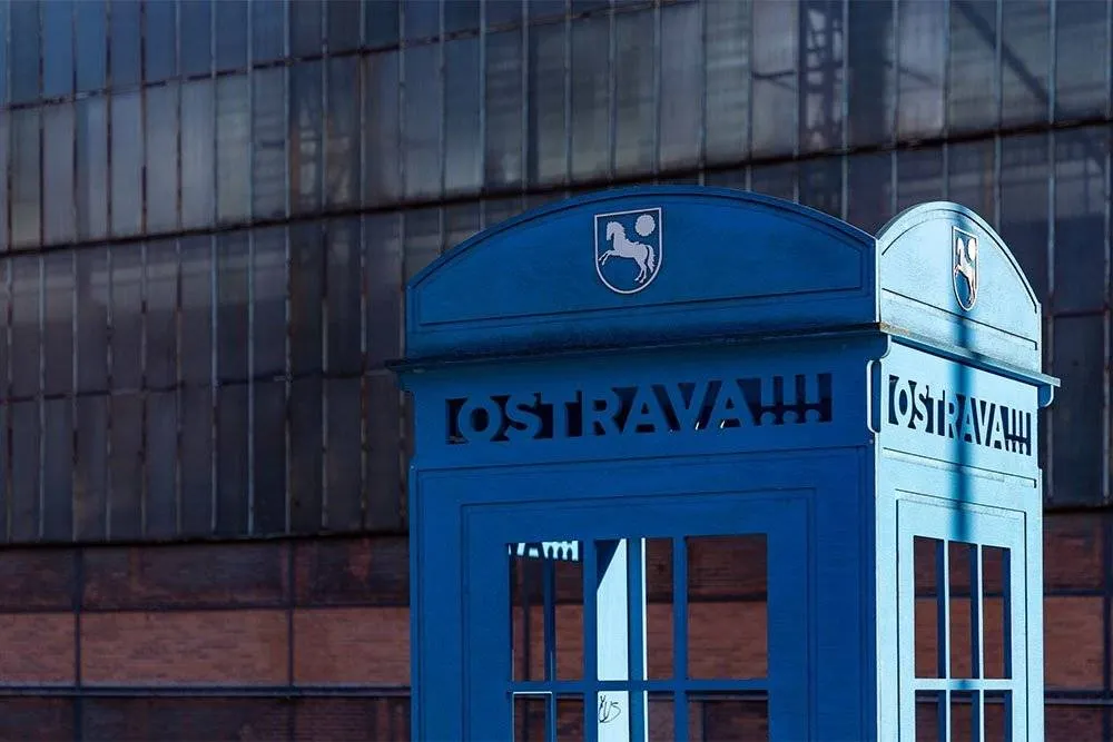 Top of an artistic blue phone box in Ostrava, featuring signature three exclamation points — Shutterstock